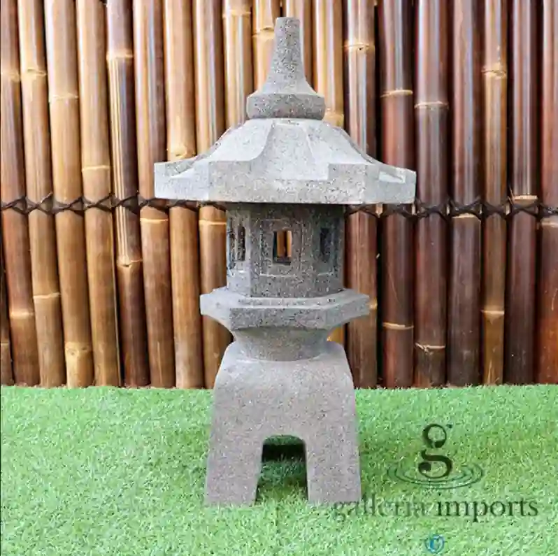 Decorative garden accessories including lanterns, bird baths, and planters